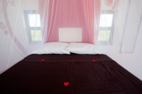 The bed inside the Palapita del Amor (the love palapita)