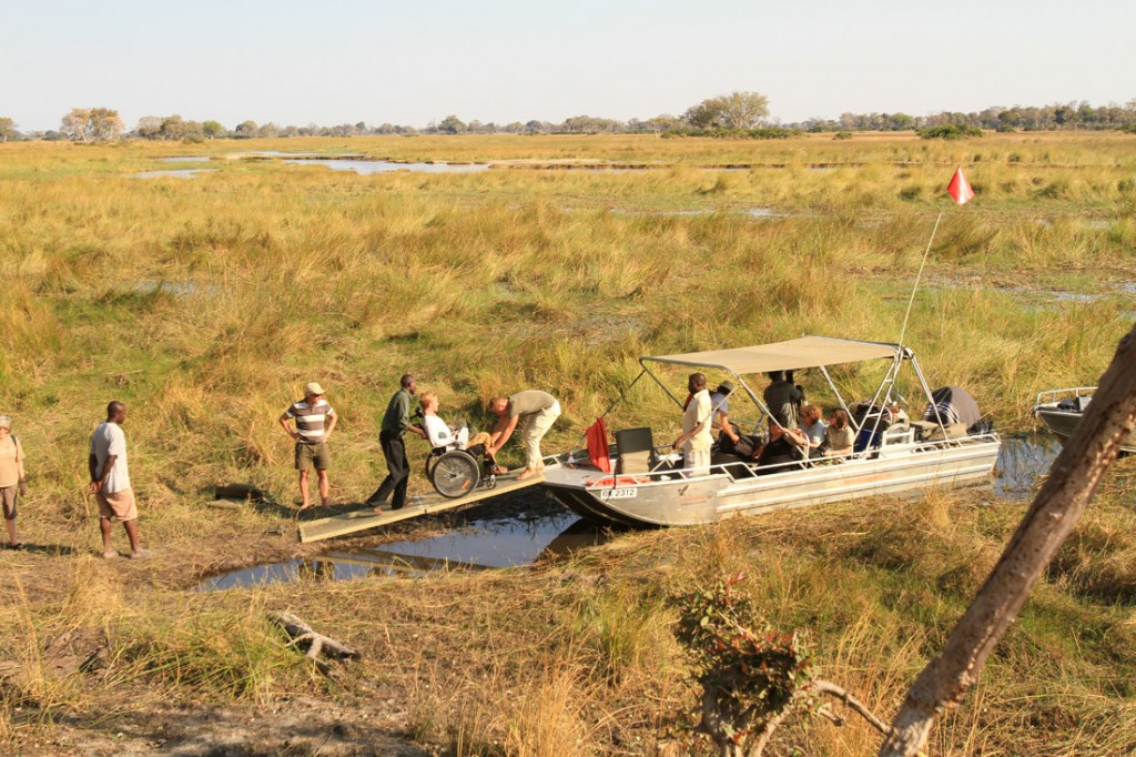 A wheelchair uses the ramp to get on the boat