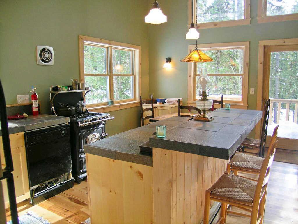 a view of the kitchen area in the cabin in the woods