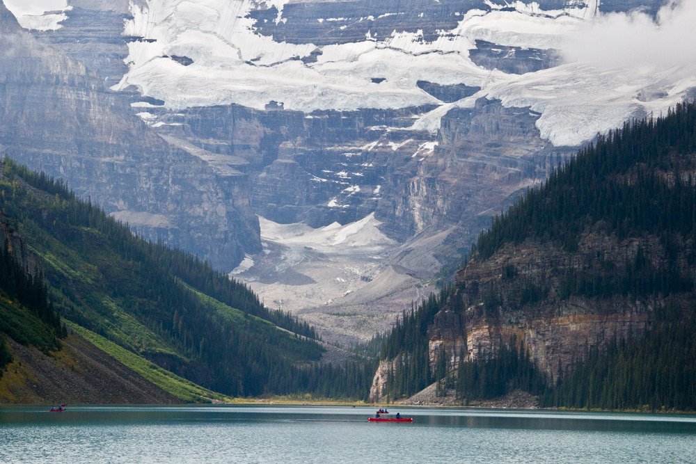 Canoe by glaciers at Lake Louise