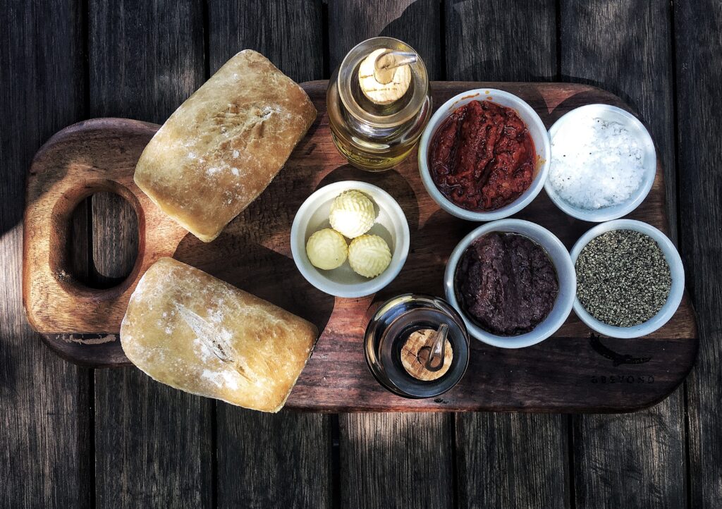 Bread and dips on a wooden board