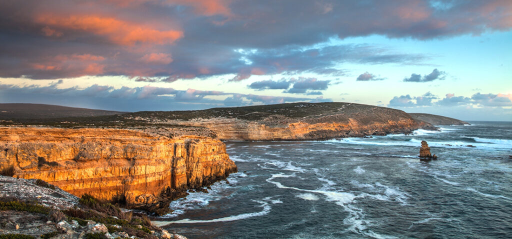coastal cliffs on a red sunset