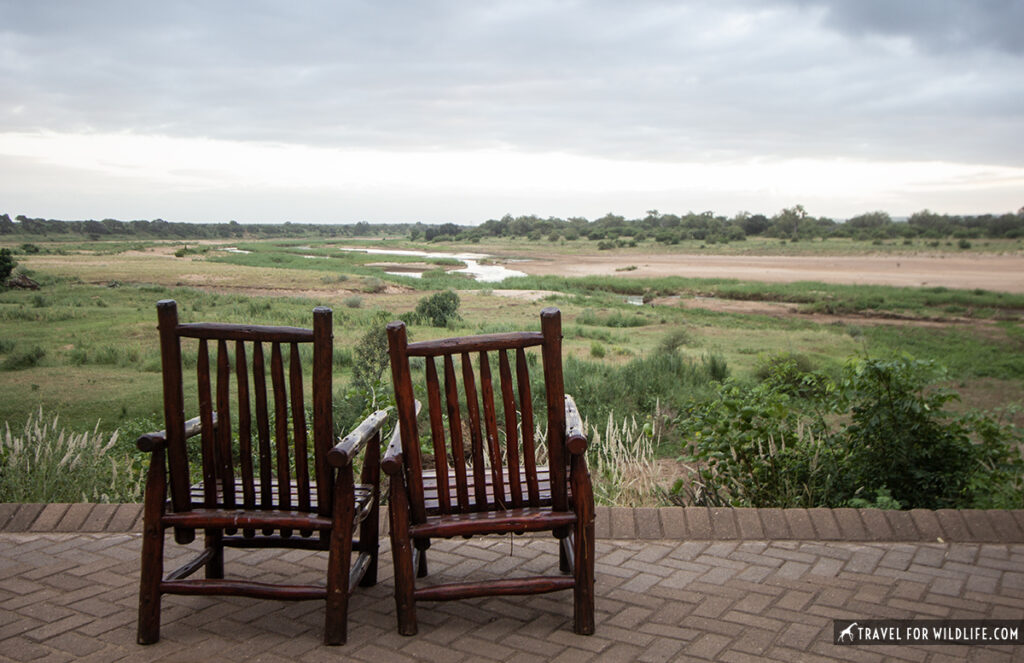 Two chairs with a river in the background