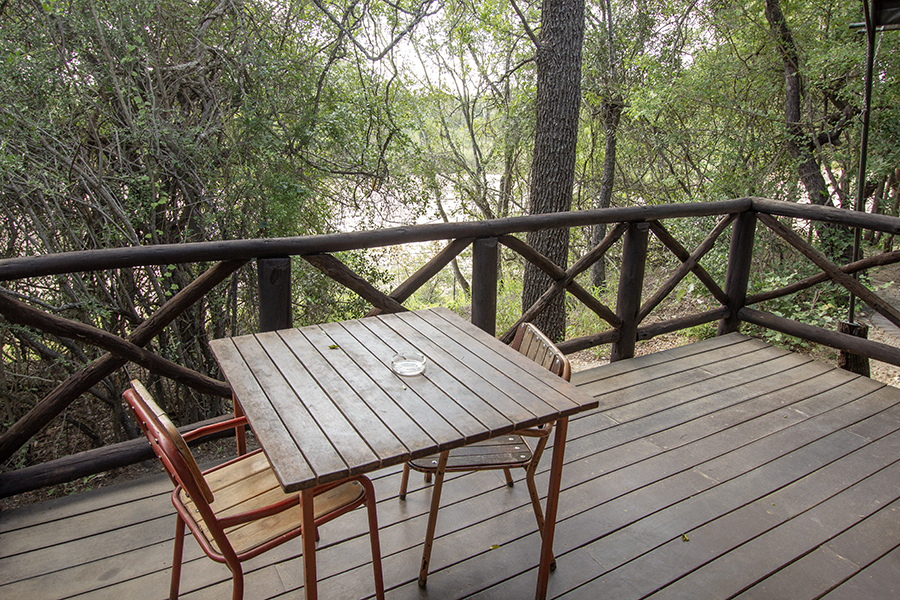 wooden deck with table and chairs