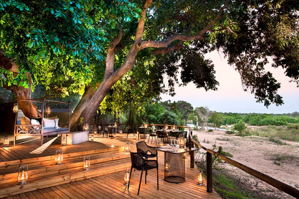 wooden deck with views over a riverbed at Lion Sands Ivory Lodge