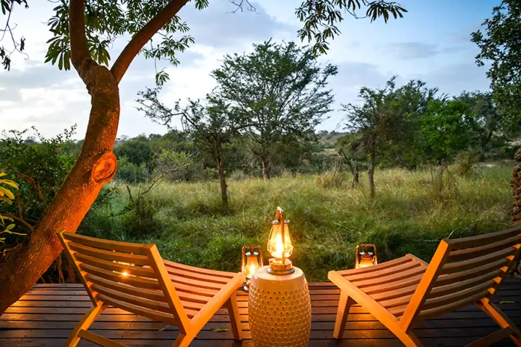 Wooden deck with two lounge chairs and savannah view