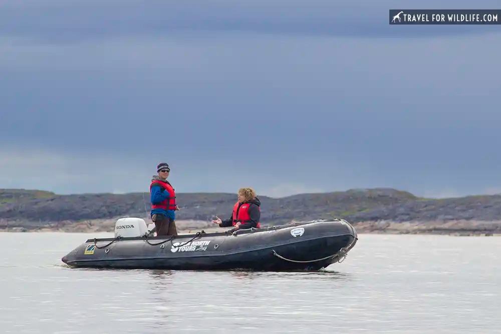 zodiak in the water with two people in it